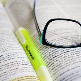 A highlighter and a textbook