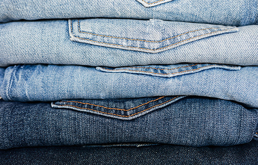 a selection of pairs of jeans in different shades