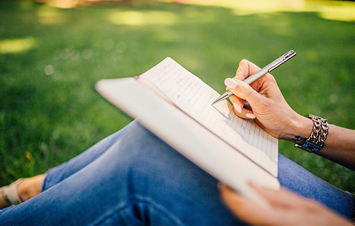 a person writing a diary