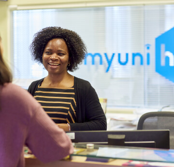 Student getting help at MyUniHub desk