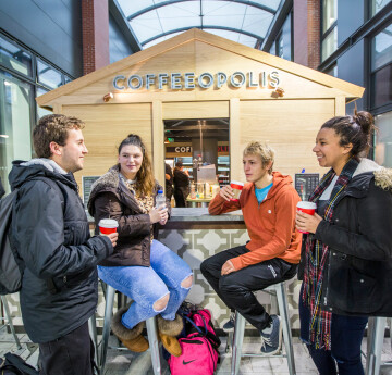 Students talking around a table