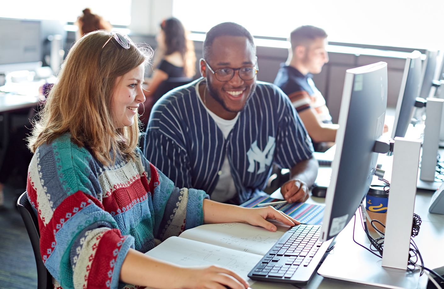 Two students at computer