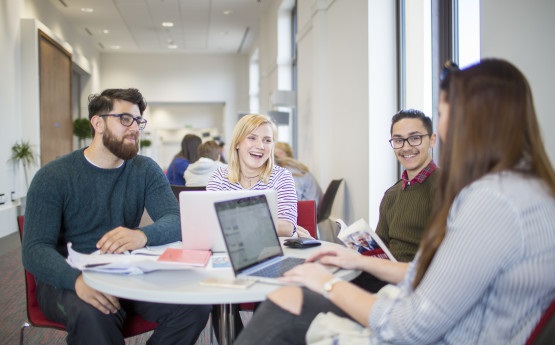 Group of students sitting around a table