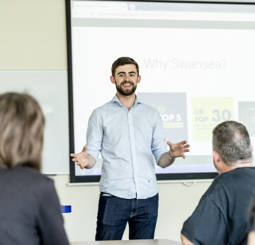 Postgraduate student giving a presentation 