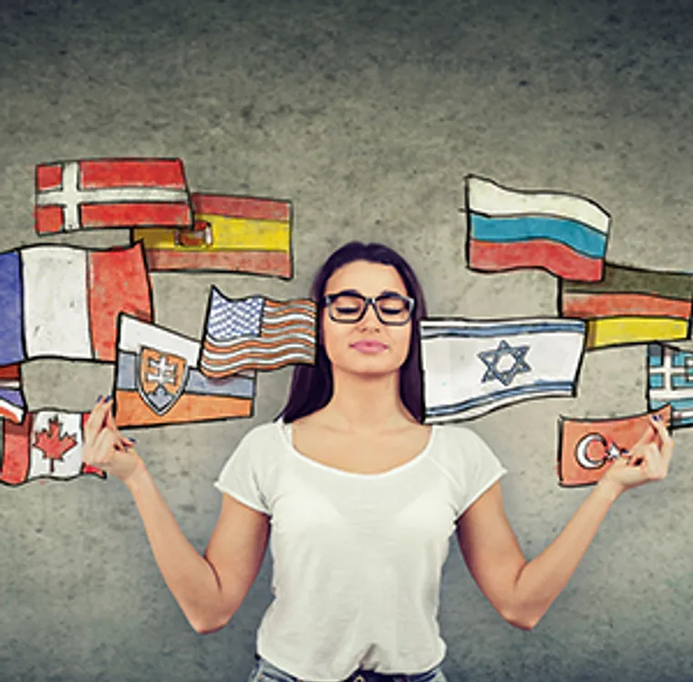 A woman surrounded by national flags