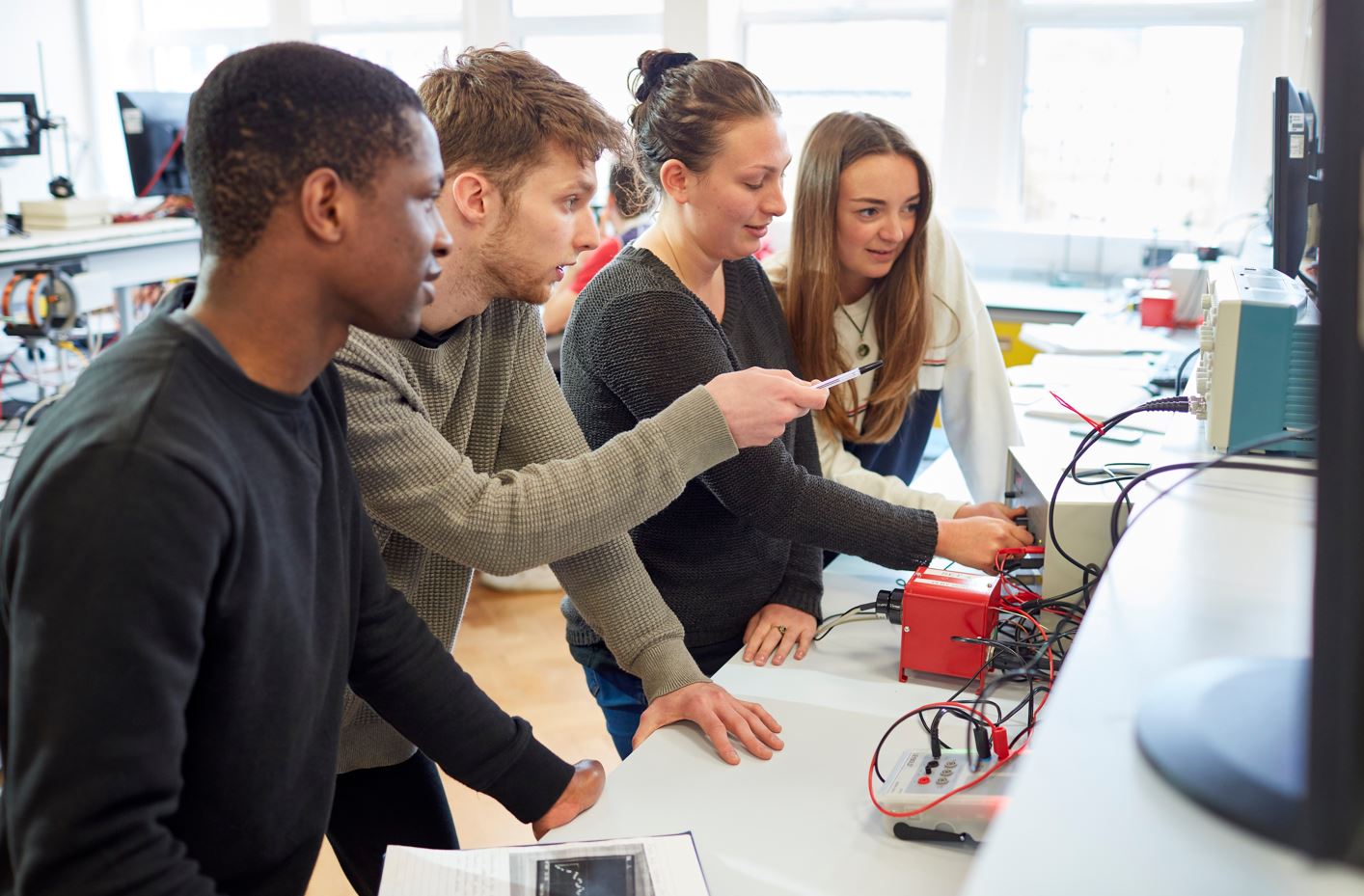 Four students in a lab