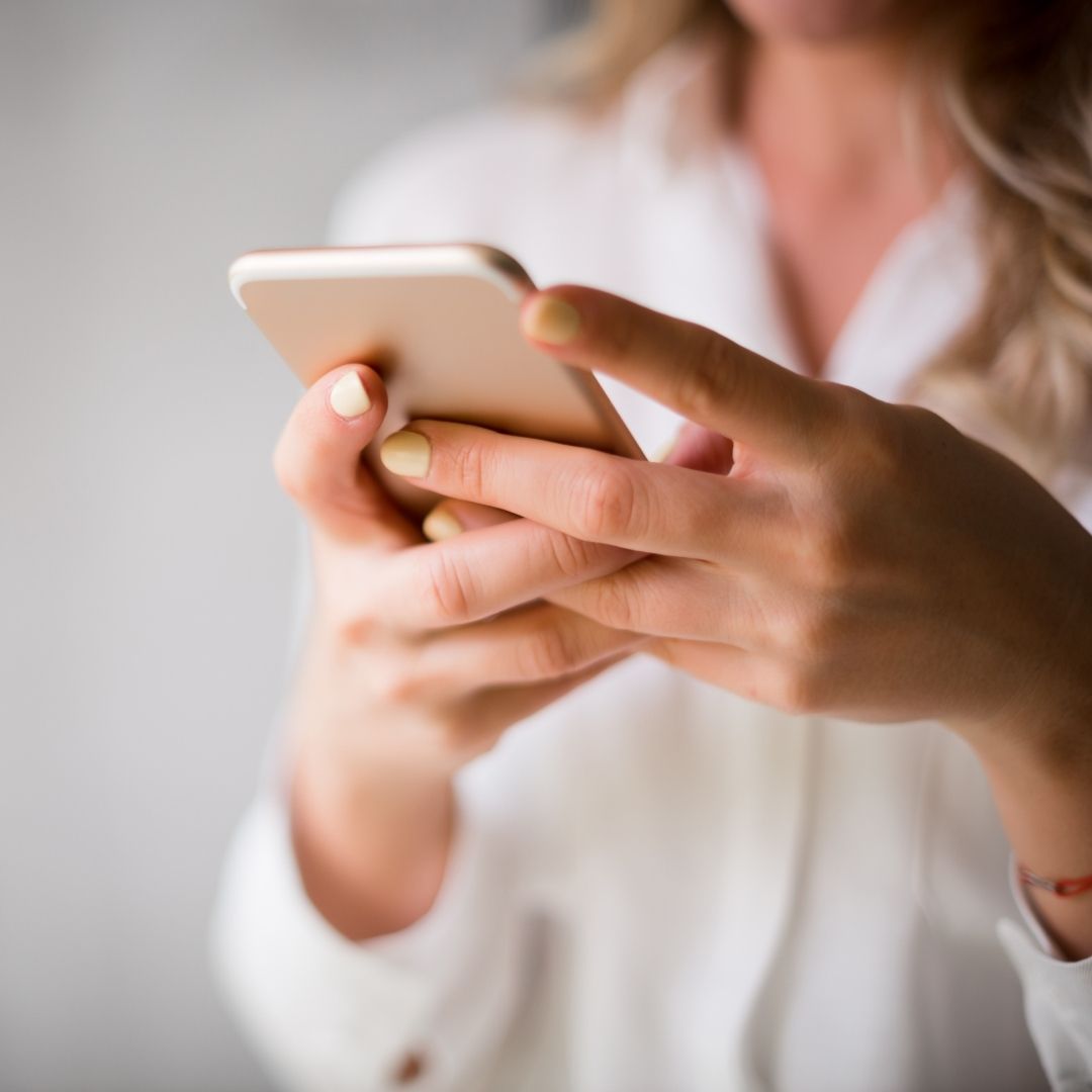 woman holding a phone