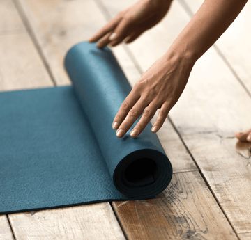 Student putting down yoga mat