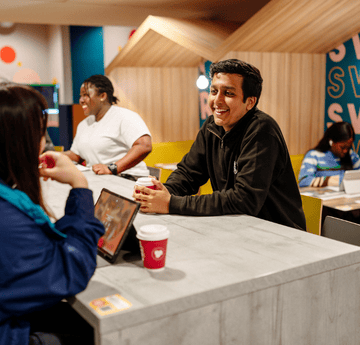 Students chatting in the social hideaway