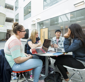 students Using Laptop