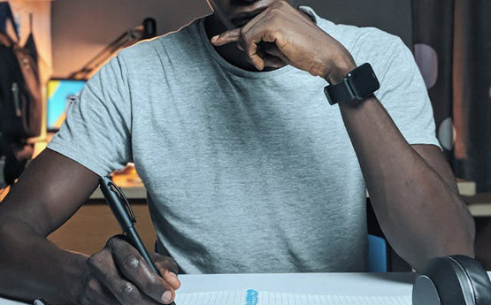 A student thinking about what they will write